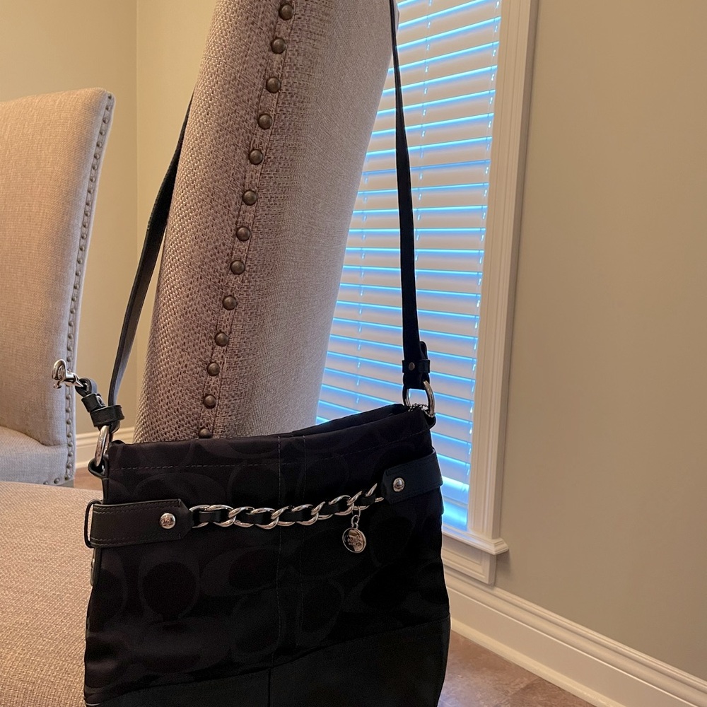 Coach black canvas (with leather bottom) cross body purse